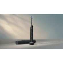Load image into Gallery viewer, Philips Sonicare Series 6100 Electric Toothbrush with Travel Case, Black HX7401/09 - in use