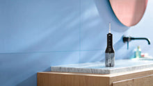 Load image into Gallery viewer, Philips Sonicare Power Flosser 3000 - in use