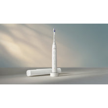 Load image into Gallery viewer, Philips Sonicare Series 6500 Electric Toothbrush with Travel Case, White HX7410/08 - in use
