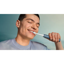 Load image into Gallery viewer, Philips Sonicare 4100 Electric Toothbrush, Marine Blue HX4043/48 - in use
