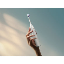 Load image into Gallery viewer, Philips Sonicare Series 6500 Electric Toothbrush with Travel Case, White HX7410/08 - in use
