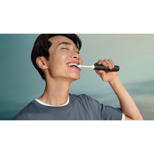 Load image into Gallery viewer, Philips Sonicare 2100 Electric Toothbrush, Black HX4021/02 - in use
