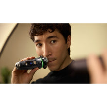 Load image into Gallery viewer, Philips Shaver Series i9000 Prestige Ultra Wet &amp; Dry with SkinIQ Pro XP9402/27 - in use
